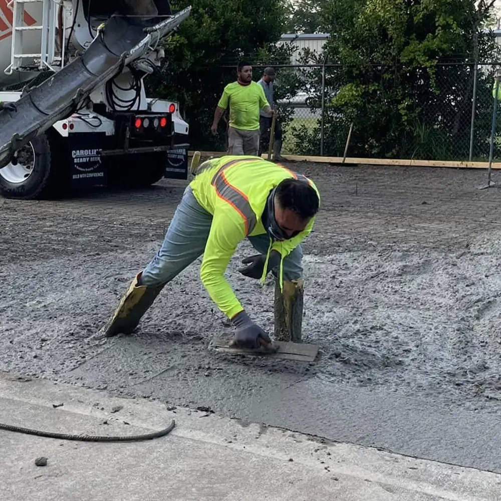 Concrete finisher spreading concrete